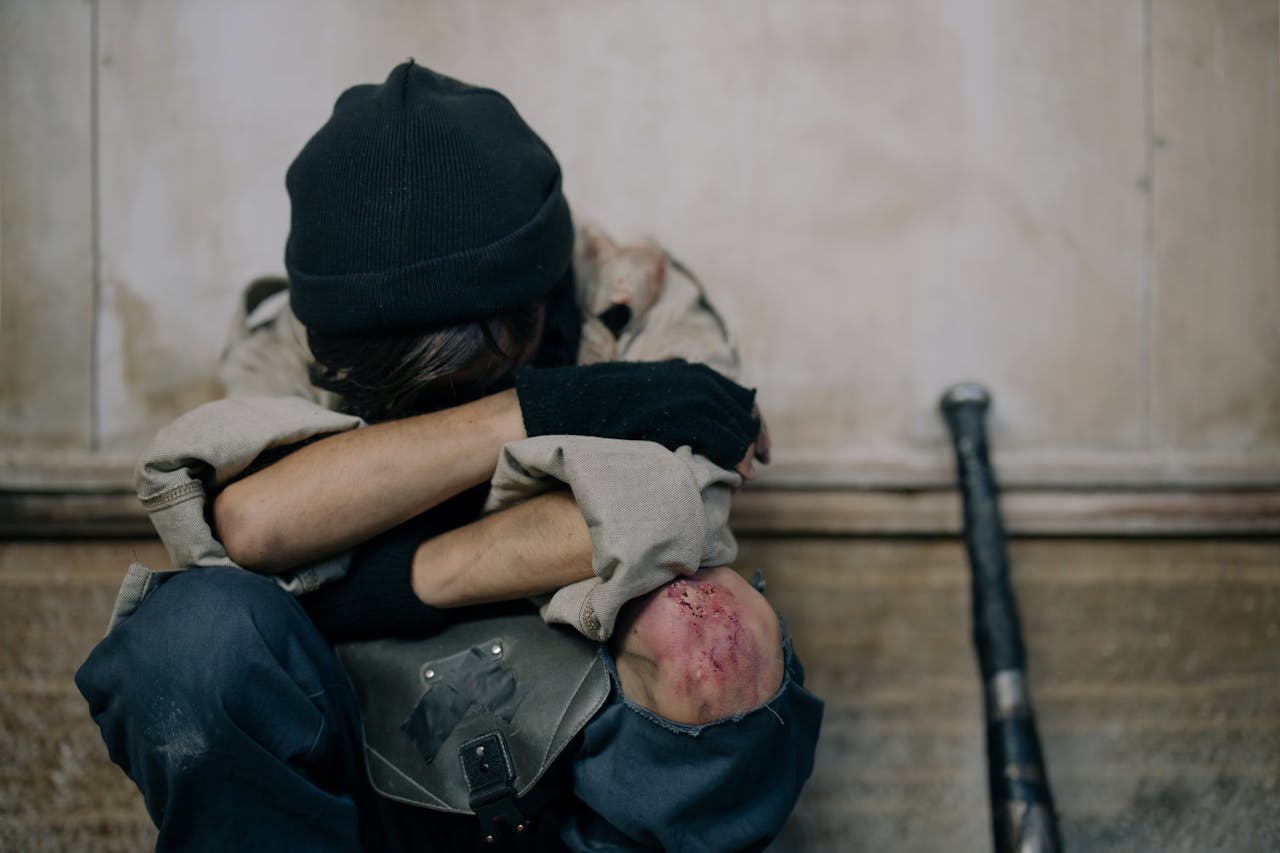 about-us A lone figure in a post-apocalyptic setting showing themes of survival and despair.